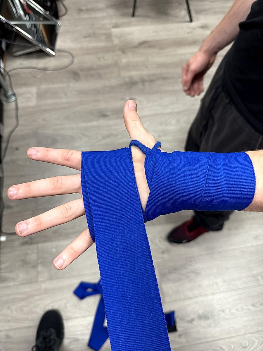 Step 3: Wrap across the knuckles with boxing hand wraps to protect the metacarpals